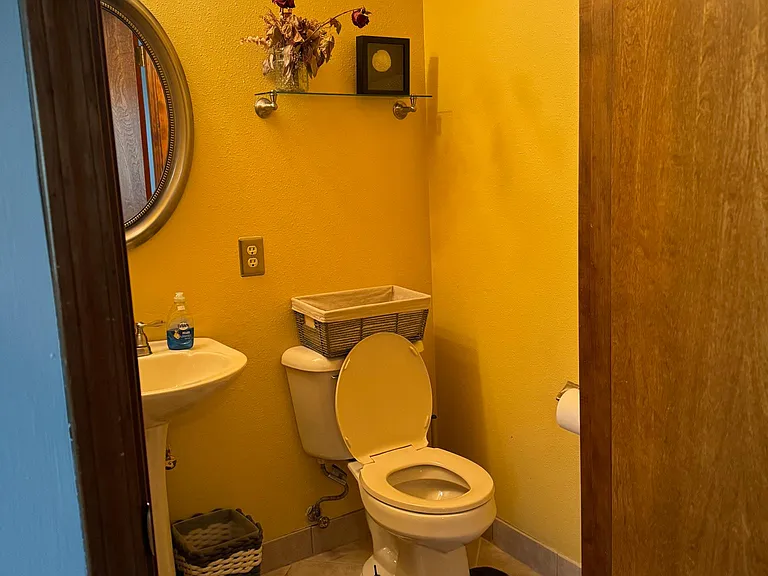1/2 bath downstairs off Bonus Room/Den