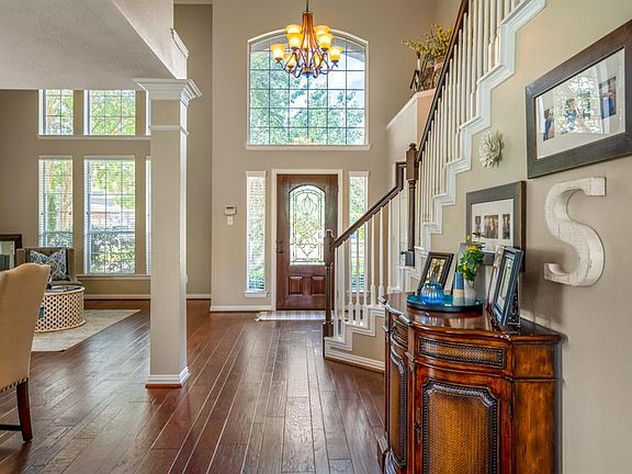 Looking back at the front door, lots of natural light streams into the home, giving it a real WOW factor from the moment you enter the glass and wood front door.