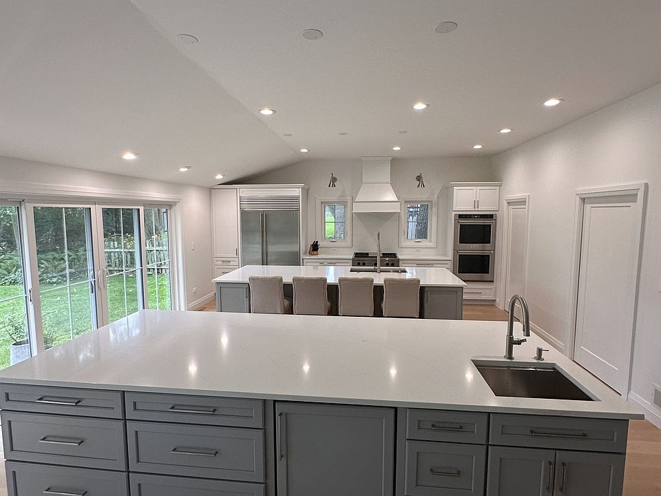 Gourmet Kitchen, double islands with two Kraus workstation sinks and beverage fridge