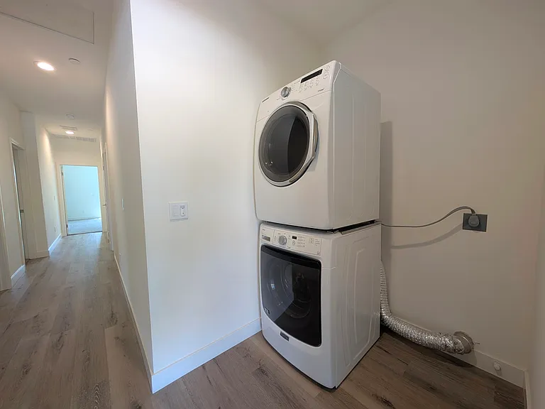 Stacked electric washer and dryer provided