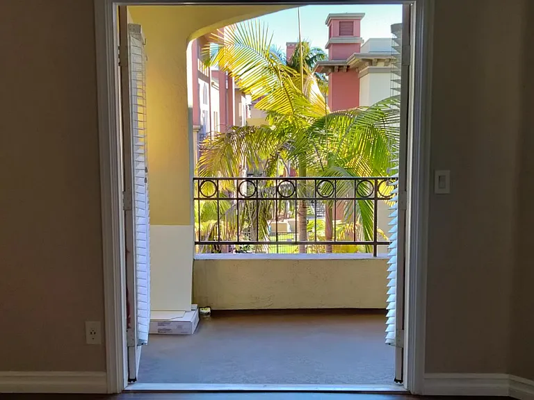 French doors open onto east facing patio which views toward the pool, spa, bbq area and gym!