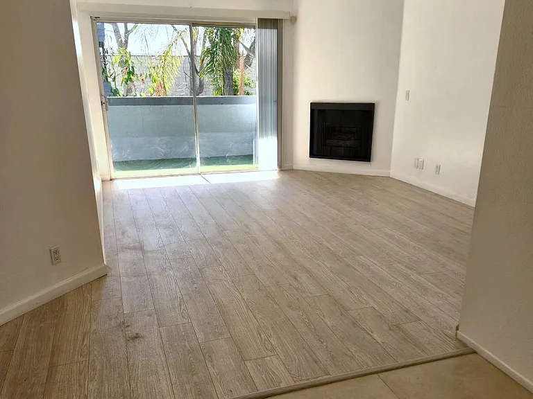 Spacious living room with large private balcony