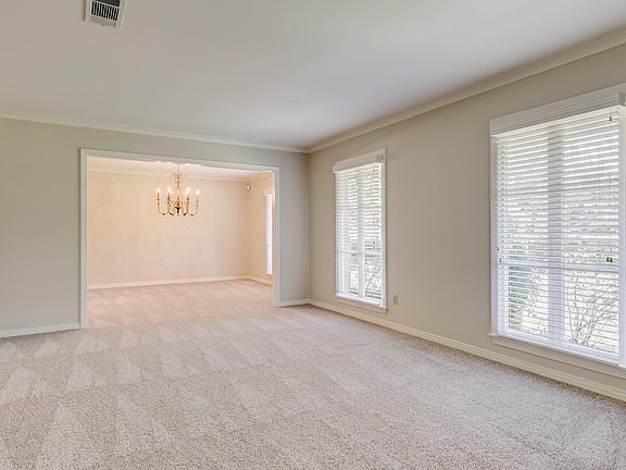 Living room & dining room with fresh paint & carpet