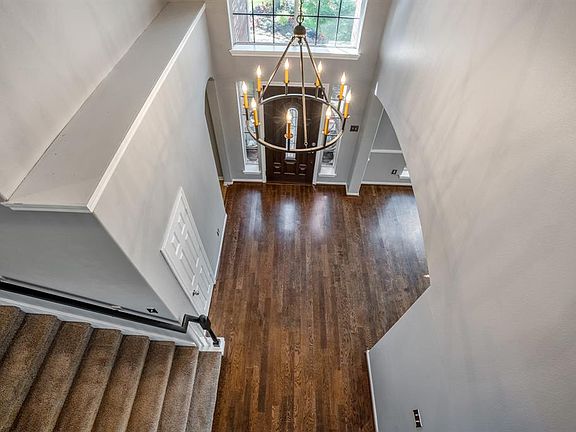 Looking down into the foyer you can appreciate the amount of space - perfect for welcoming guests.
