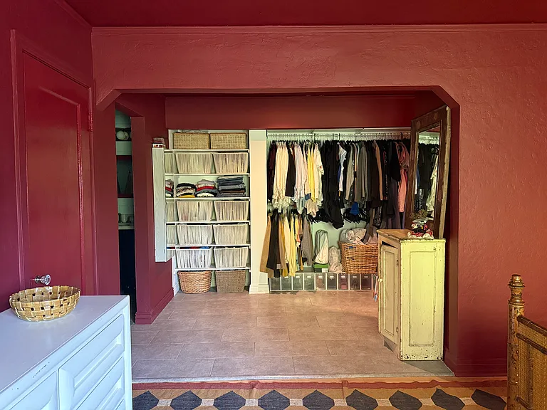 view from primary bedroom looking into the closet/laundry area