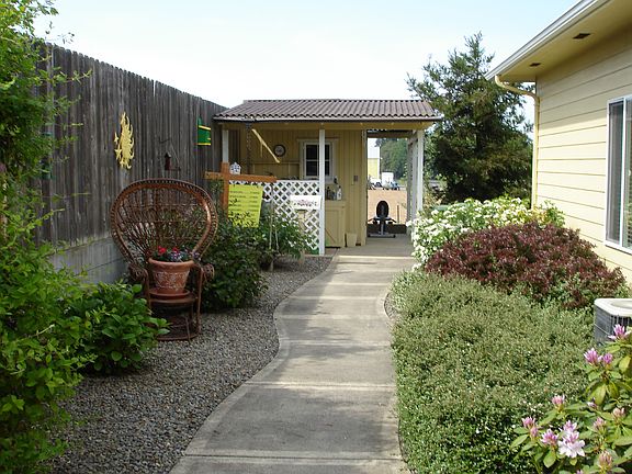 Side yard, green house with power and water