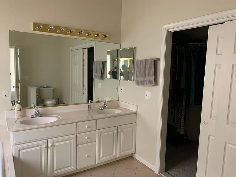 Double sinks in master bedroom (with new hardware from May 2022); walk-in closet