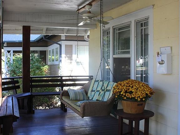 ...have a seat on the front porch and enjoy the large trees in the front yard and down the street.