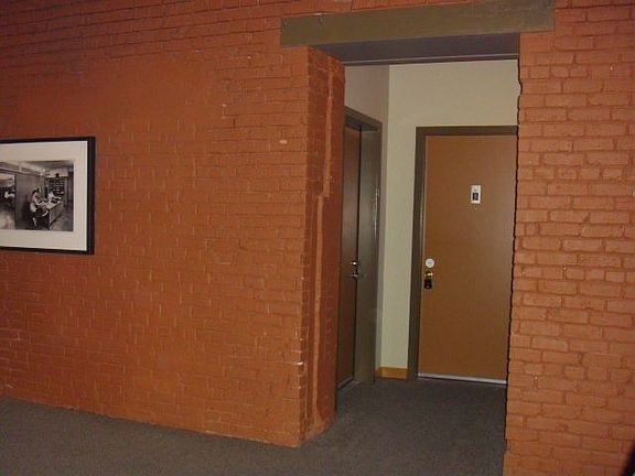 After taking the elevator up, you will find the entrance door as shown