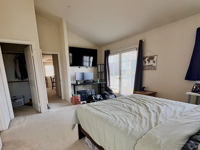 Primary BR fo rent! Opens into the dining room and also onto the patio.