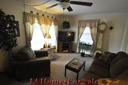 Living Room-new carpet-natural lighting and high cove ceiling.