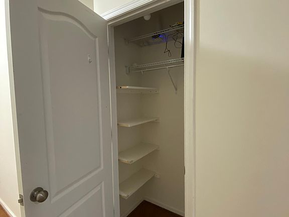 coat room with shelving