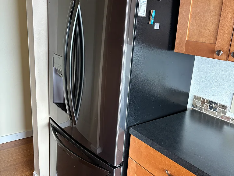 New French door refrigerator with filtered water and ice.