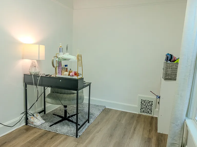 Bedroom #2 filled with natural light from large windows.