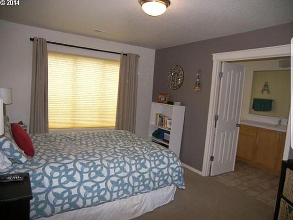 Standing 1ft inside master bedroom doorway. Master bathroom on right side of picture. Bathtub behind left white double door. Not pictured on the right inside master bath is a shower, walk in closet, toilet