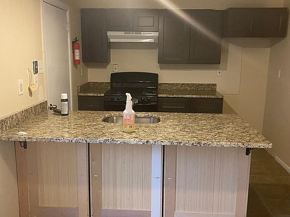 new kitchen with granite counter tops.