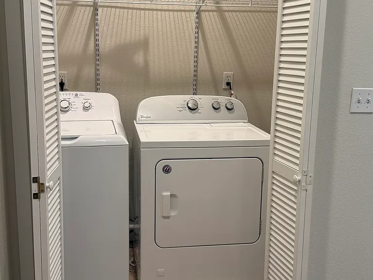Laundry closet upstairs with Washer and Dryer