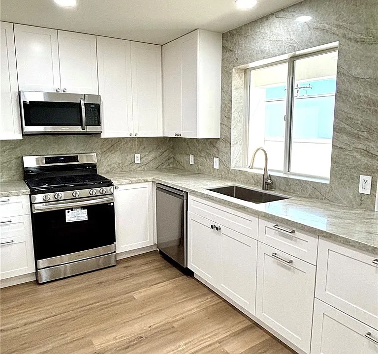 310 E Grand Ave #208