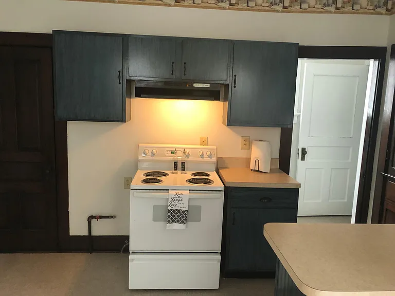 #4 photos of kitchen. door on left is to cellar where furnace & water heater are located.