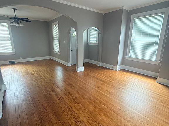 Front living room and formal dining area. High ceilings and original oak floors. This space is on the front of the house with great lighting.