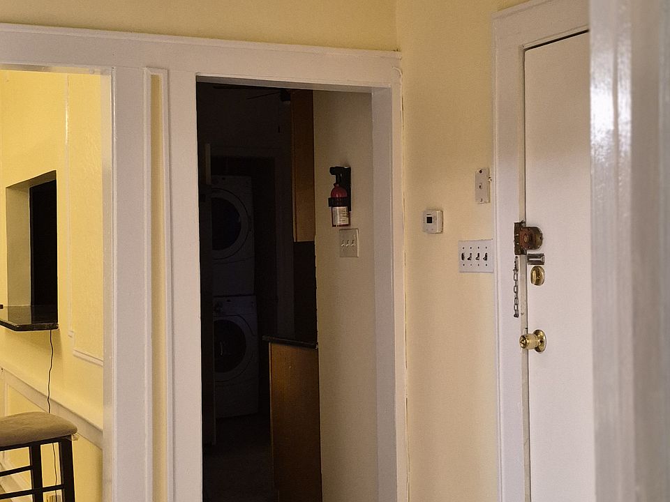 1 of 2 entrance ways and foyer. Kitchen entrance to right, dining and living room walkway to left.