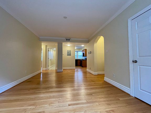 living room facing kitchen & bathroom