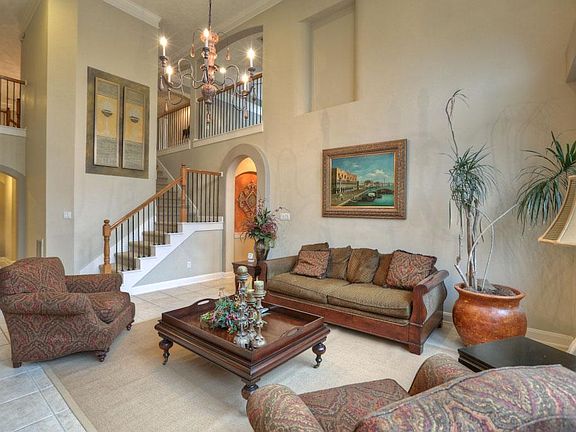 Second staircase in the back and high ceilings.