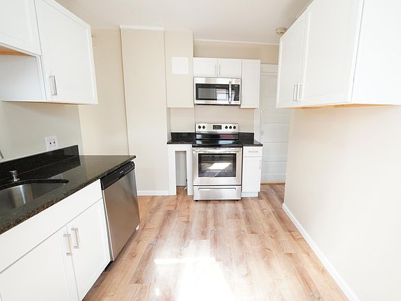 Renovated eat-in kitchen with new stainless appliances