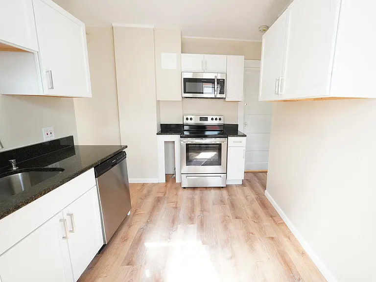 Renovated eat-in kitchen with new stainless appliances