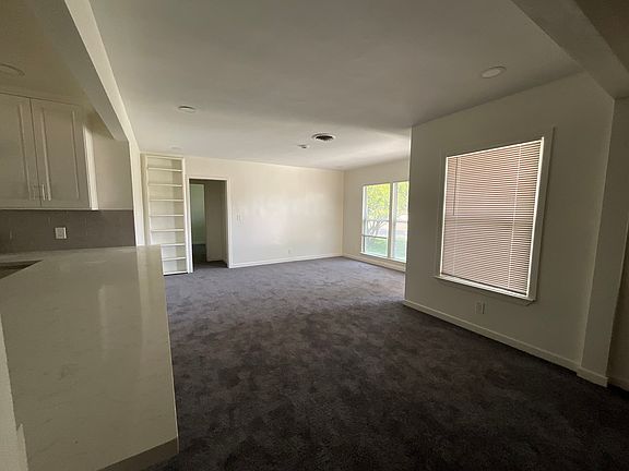 You enter into the living room that flows very nicely into the dining room and the large kitchen