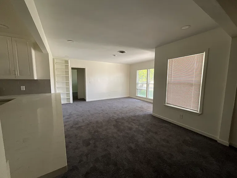 You enter into the living room that flows very nicely into the dining room and the large kitchen