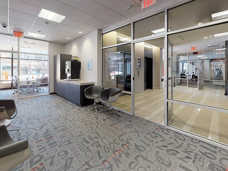 Bright glass business center with complimentary Starbucks