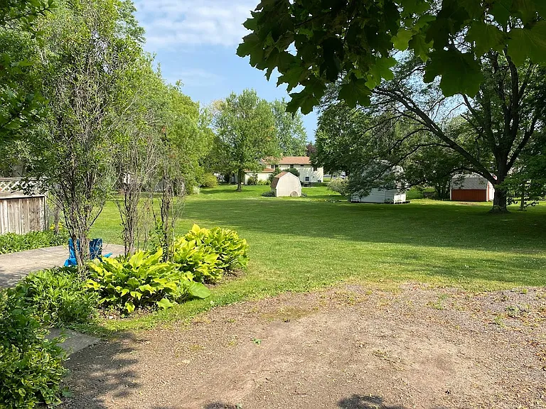 Rear of driveway view into shared backyard.
