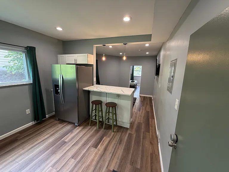 Kitchen with full-size fridge/freezer + Living Room