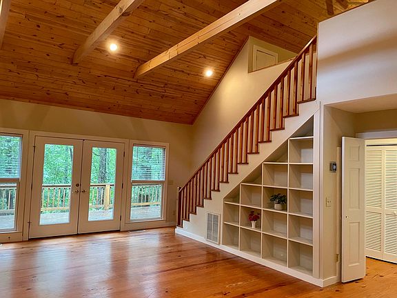 Stairs to loft area. Back deck out window.