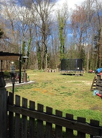 showing the larger fenced in part of the huge backyard