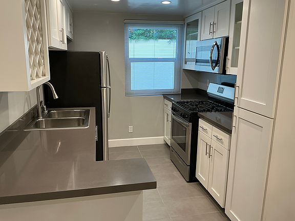 Recently upgraded kitchen with well appointed appliances and ample cabinet and counter top space, as well as lots of natural light.