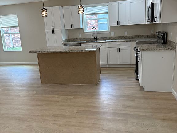 Kitchen with all new cabinets, appliances, island and lighting