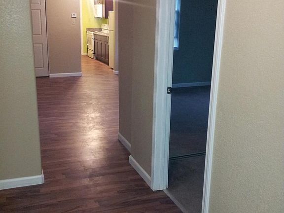 hall way, bedroom to right, kitchen past living/dinning