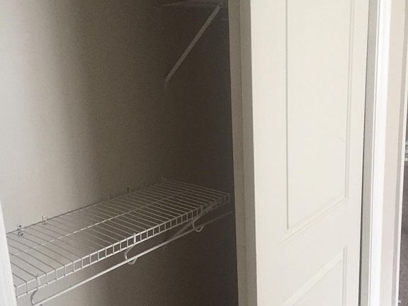 CLOSET WITH MODERN SHELVES