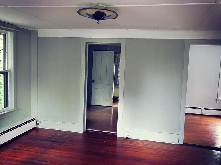 Our photos of living room. Kitchen on left, bedroom on right.