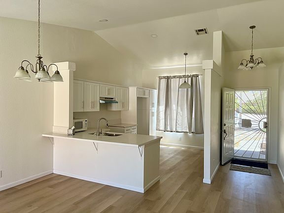 House entrance adjacent to kitchen.