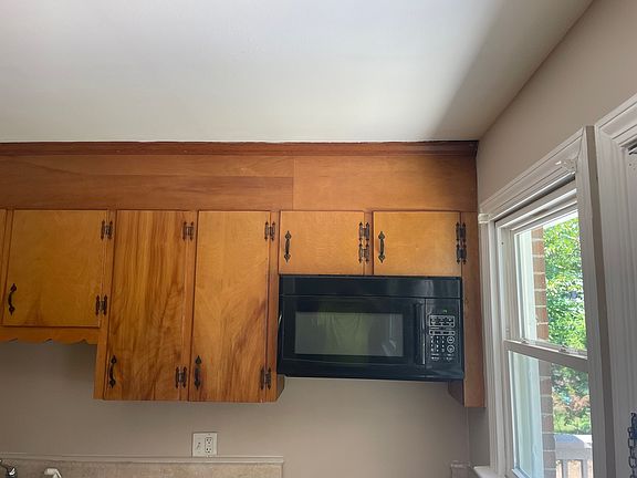 Kitchen with door to large deck