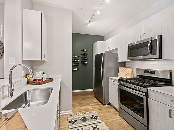Fully loaded kitchens with stainless steel appliances and beautiful counter tops