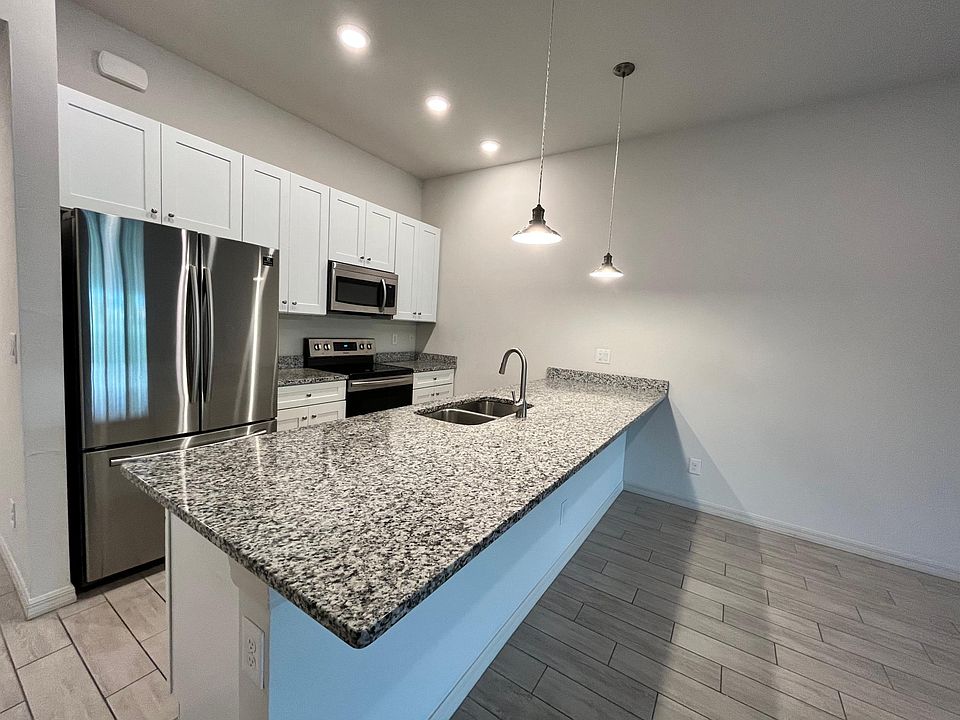Chef's kitchen with stainless steel appliances and wooden 42' cabinet with soft close drawers and doors