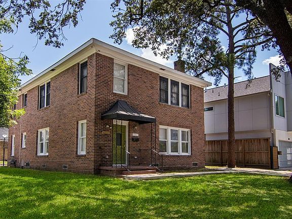 Front yard with Unit 1 off-street parking on the left (downstairs unit)