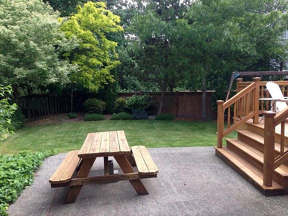 Concrete patio & picnic area backing up to 2.5 acre greenbel