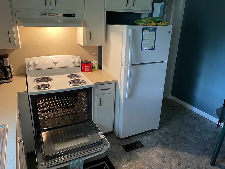 Kitchen with newer stove and fridge