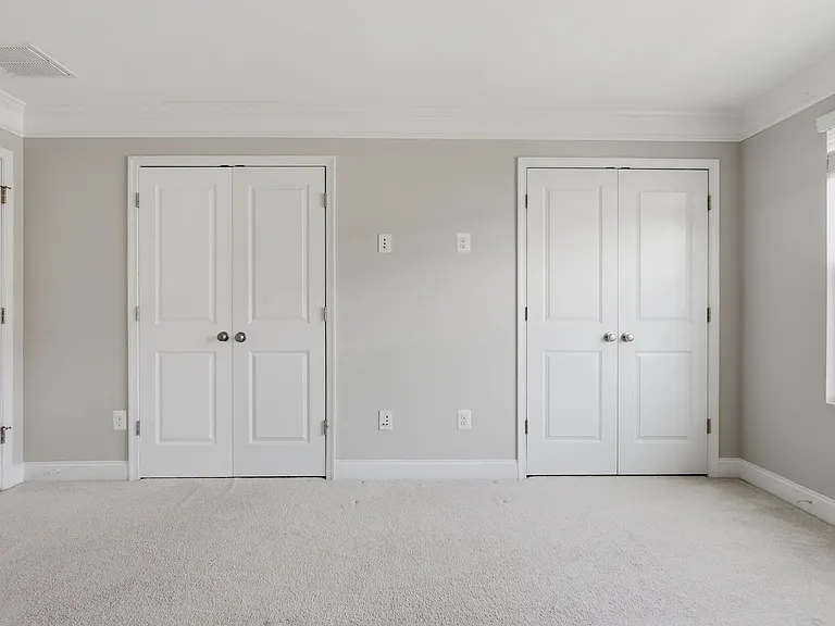 3rd-floor primary bedroom with two closets.