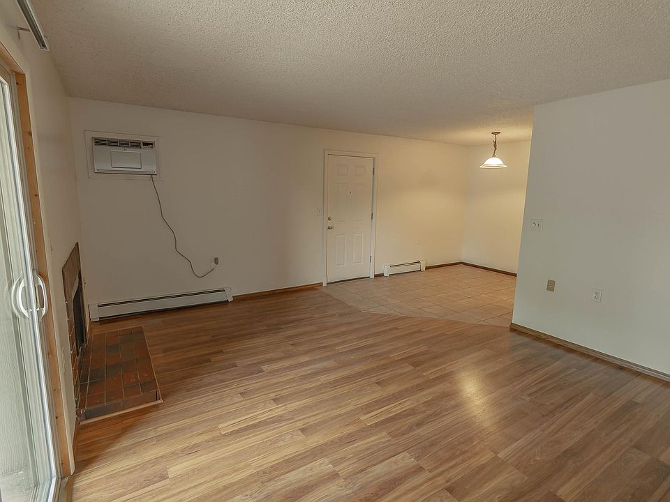 Living Room, Dining Room with fireplace & window A/C